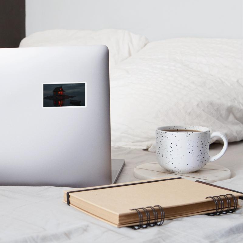 A small, rustic wooden cabin with a pitched roof